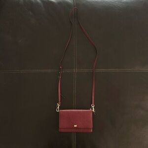 Michael Kay’s small red clutch